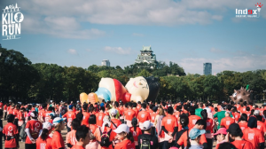 Giant inflatable character installation at an outdoor marathon event