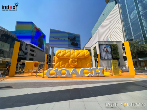 Large COACH product inflatable structure installed in front of a shopping mall