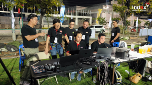 Technical crew operating the drone show control system backstage