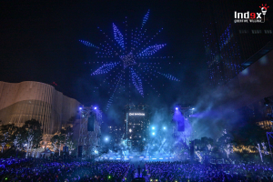 Drone show forming a snowflake above the One Bangkok event stage