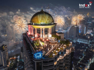 Luxury rooftop event in Bangkok with fireworks display and city skyline view